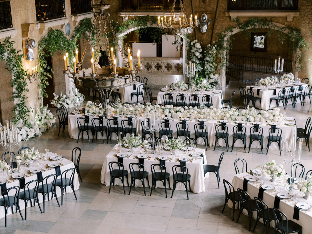 Mt. Stephen Hall set up for an elegant wedding at the Banff Springs Hotel. All white floral design with black chairs captured by Banff Wedding Photographer Justine Milton.