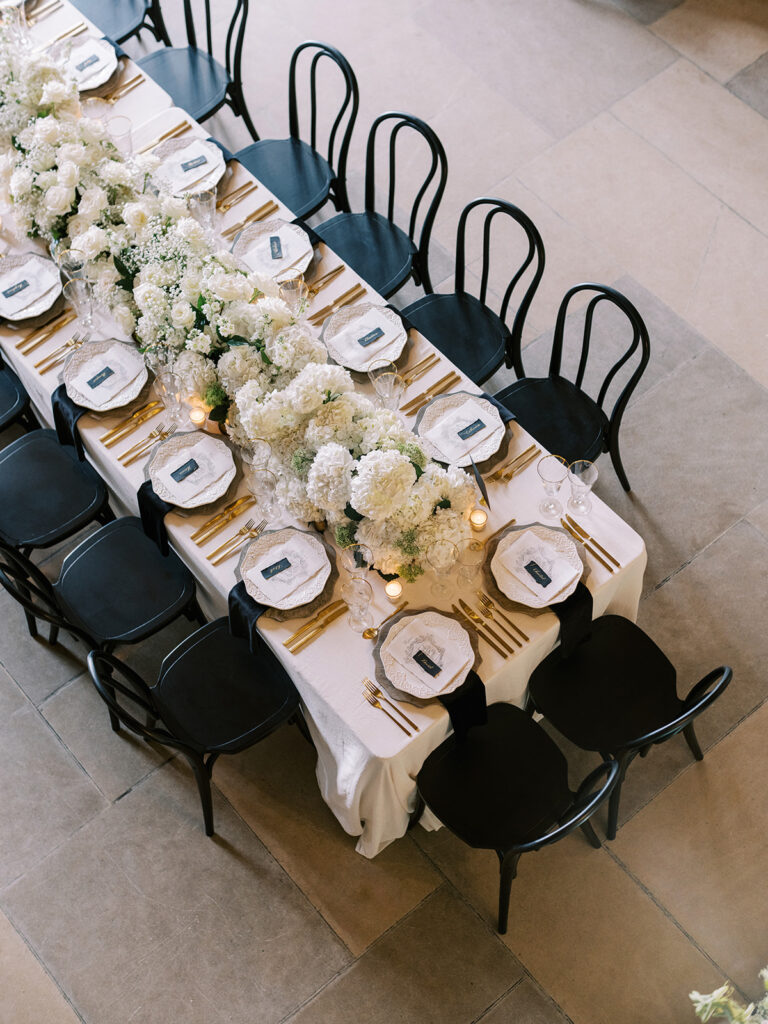 top down view of a table design at the Banff Springs Hotel, all white florals with black accents.