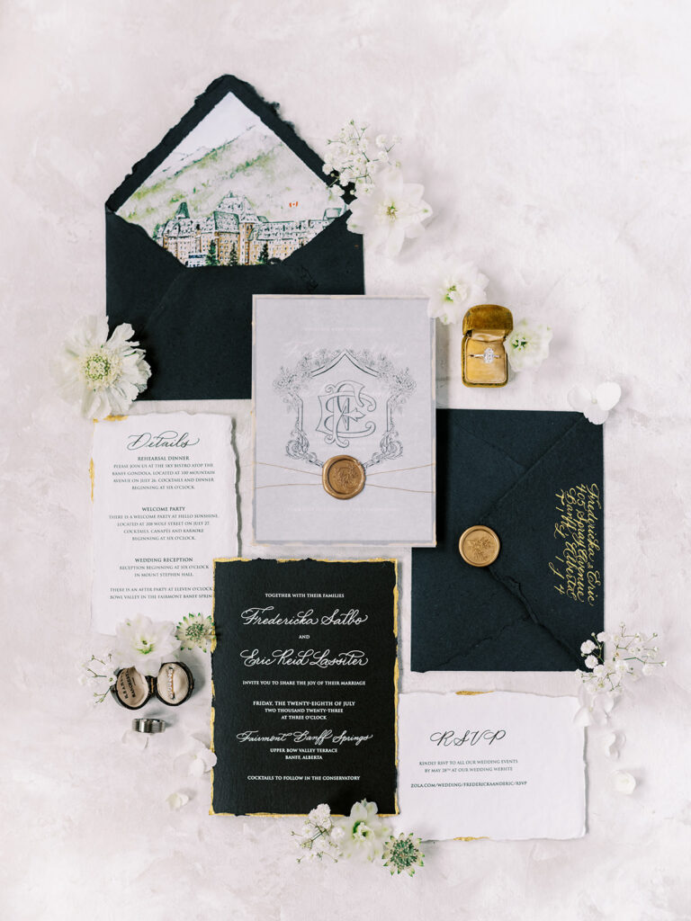 hand painted watercolor of The Fairmont Banff Springs Hotel in this stunning stationery suite captured by Banff Wedding Photographer Justine Milton