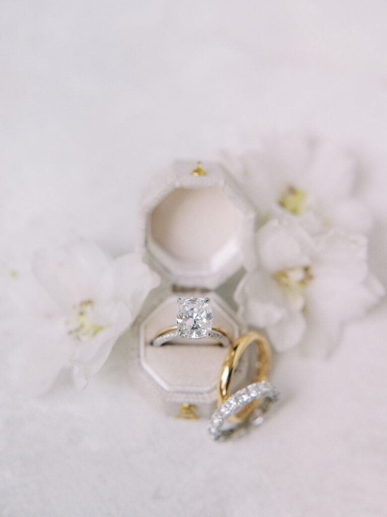 oval cut diamond engagement ring and wedding bands captured by Canadian and destination wedding photographer Justine Milton