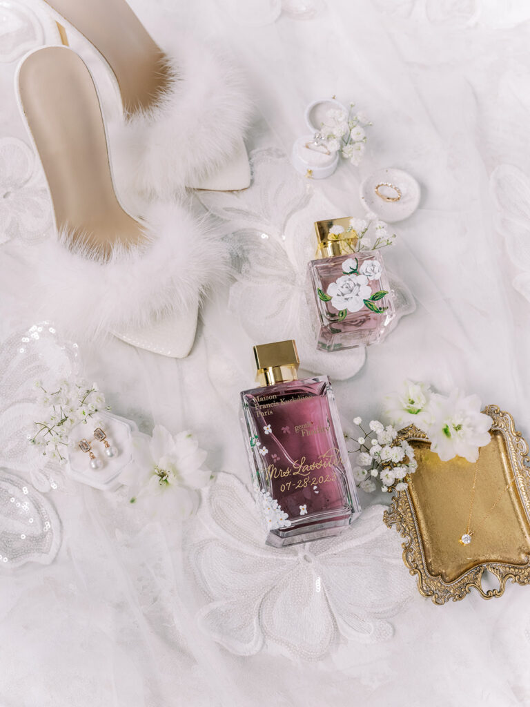 Brides personal details, feather shoes and custom painted and engraved perfume bottles captured by Banff Wedding Photographer Justine Milton