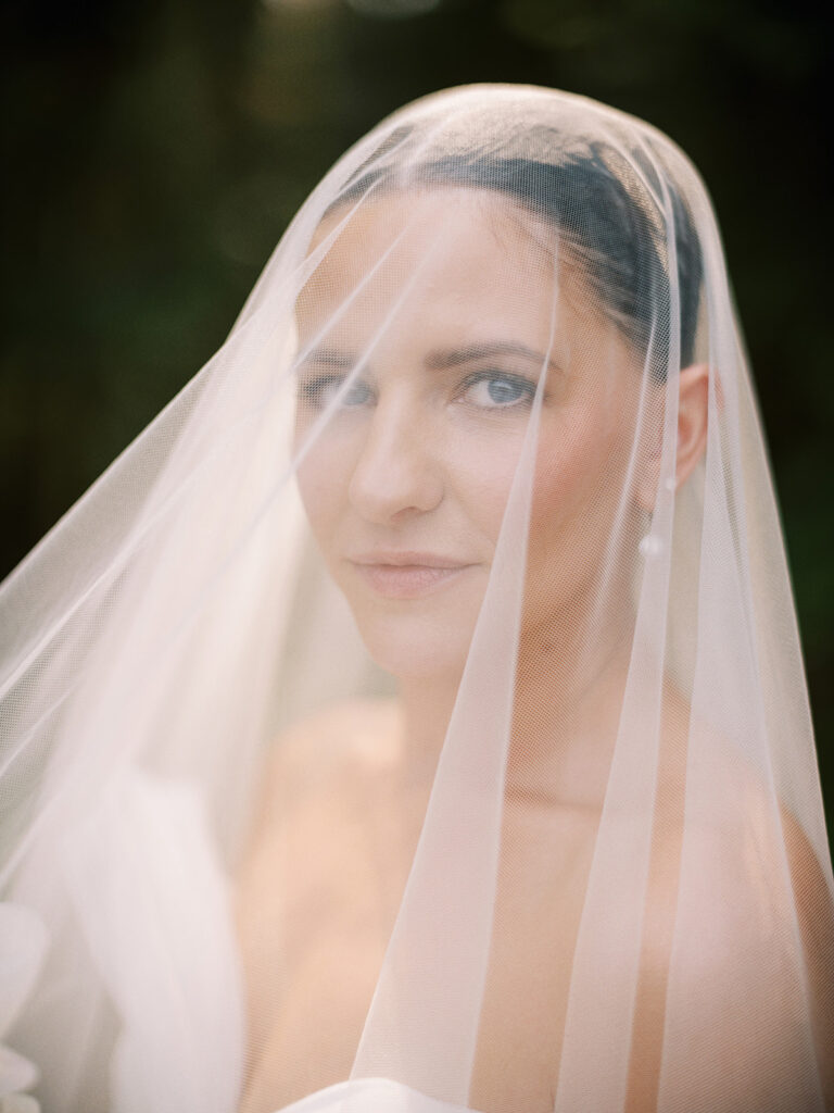 classic bridal portrait with blusher veil captured by Canadian and destination wedding photographer Justine Milton